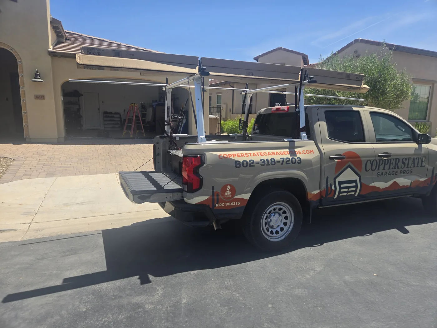 Copper State Garage Pros service truck parked at a residential garage door job in San Tan Valley, AZ